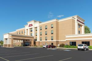 a rendering of a hotel with cars parked in a parking lot at Hampton Inn & Suites Marshalltown in Marshalltown
