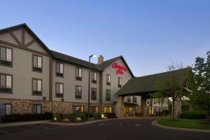 a hotel with a sign on the front of it at Hampton Inn Kansas City The Legends in Kansas City