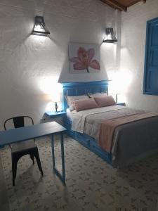 Postel nebo postele na pokoji v ubytování Hotel Concepción Antioquia