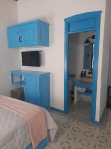 Postel nebo postele na pokoji v ubytování Hotel Concepción Antioquia