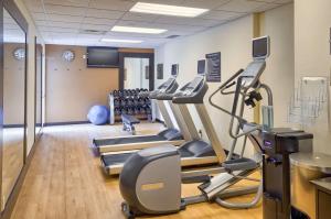 a gym with treadmills and ellipticals in a room at Homewood Suites by Hilton Mobile in Mobile