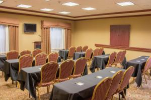 a conference room with tables and chairs and a podium at Hampton Inn Murphy in Murphy