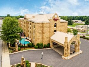 an aerial view of a large building with a pool at Hampton Inn Newberry Opera House in Newberry