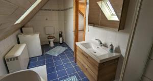a small bathroom with a sink and a toilet at Baldwin's Home Away from Home in Berndroth +3 photos