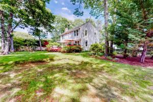 an image of a house with a yard at Overland Glen in Mashpee