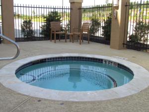 a small swimming pool in the middle of a patio at Hampton Inn & Suites Center in Center