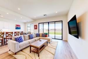 a living room with a couch and a table at Desert Oasis in Prescott Valley