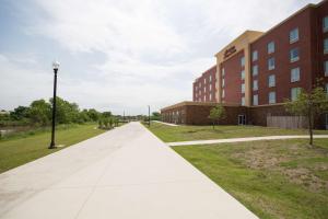 a walkway in front of a building at Hampton Inn & Suites Oklahoma City Airport in Oklahoma City