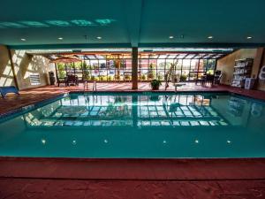 a large swimming pool in a building at Hampton Inn Edmond in Edmond