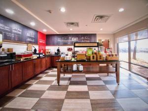 a fast food restaurant with a checkerboard floor at Hampton Inn Edmond in Edmond