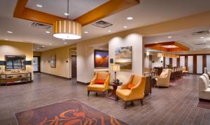 a lobby of a hospital with chairs and a waiting room at Hampton Inn Omaha/West Dodge Road, Old Mill in Omaha