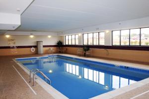 a large swimming pool in a building at Hampton Inn & Suites Murray in Murray