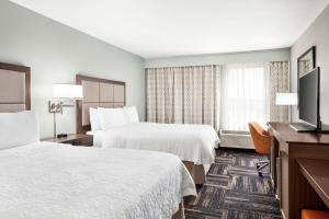 Postel nebo postele na pokoji v ubytování Hampton Inn Paris