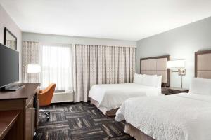 Postel nebo postele na pokoji v ubytování Hampton Inn Paris
