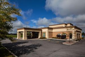 a large office building with a parking lot at Hampton Inn by Hilton Napanee in Napanee