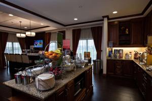 a kitchen with a counter with a bunch of food on it at Hampton Inn by Hilton Napanee in Napanee