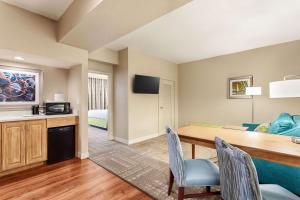 a living room and dining room with a table and chairs at Hampton Inn Pawleys Island in Pawleys Island