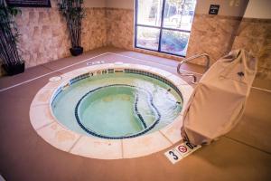 a small swimming pool in a room with a bag at Hampton Inn - Monticello in Monticello