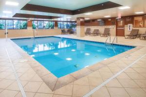 a large pool with blue water in a building at Hampton Inn Oxford/Miami University Area in Oxford
