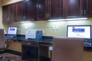 a office with two laptops and a printer on a desk at Hampton Inn Oxford/Miami University Area in Oxford