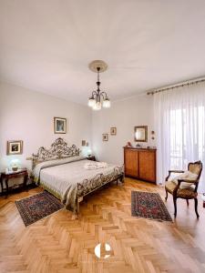 a bedroom with a bed and a chandelier at Borgo Antico in Atessa