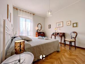 a bedroom with a bed and a table and a mirror at Borgo Antico in Atessa
