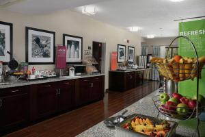 a kitchen with a counter with fruit in a basket at Hampton Inn Juno Beach in Juno Beach