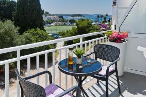 a table and chairs on a balcony with a view at Luxury Apartment Veronika in Hvar