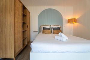 Postel nebo postele na pokoji v ubytování Le Sable Doré - Piscine et parking