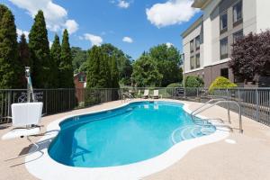 a swimming pool in front of a building at Hampton Inn Pittsburgh/West Mifflin in West Mifflin