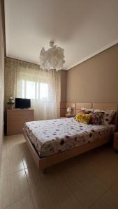 En eller flere senge i et værelse på Apartamento Oropesa Marinador + 23 billeder