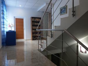 a hallway with a staircase and a door at Hotel Vila Alex in Costinesti