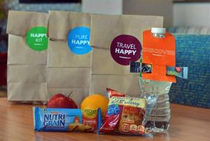 a table with a bag of groceries and some food at Hampton Inn Bath - Brunswick Area , ME in Bath