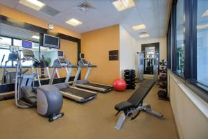 a gym with several treadmills and exercise bikes at Hilton Garden Inn Portland Downtown Waterfront in Portland