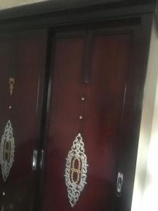 a wooden door with a white design on it at Grand M 