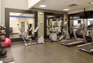 a gym with treadmills and cardio equipment in a room at Hampton Inn Portland-Airport in South Portland