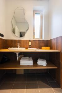 a bathroom with a sink and a mirror at Lodges de Lemptégy in Saint-Ours