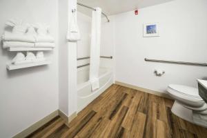 a bathroom with a toilet and a shower at Hampton Inn Wilson Downtown in Wilson