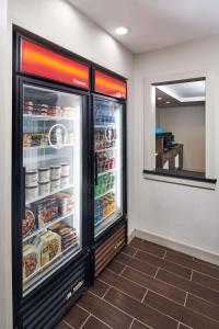 a refrigerator with food inside of a restaurant at Hampton Inn & Suites Chapel Hill/Durham in Chapel Hill