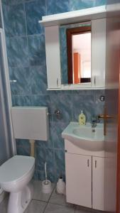 Kúpeľňa v ubytovaní Apartments Popov