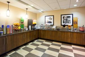 a restaurant with a buffet line with food at Hampton Inn Rockford in Rockford