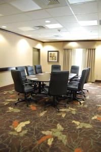 a conference room with a table and chairs at Hampton Inn Geneseo in Geneseo +37 photos