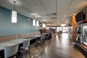 a restaurant with tables and chairs in a room at Hampton Inn Rolla in Rolla