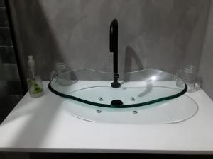 a sink with a hose on top of a counter at Suíte Jacarecica I in Maceió +12 photos
