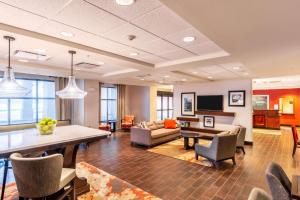 a living room with a table and chairs and a couch at Hampton Inn Rawlins in Rawlins