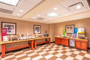 a restaurant with two counters in a room at Hampton Inn Rawlins in Rawlins