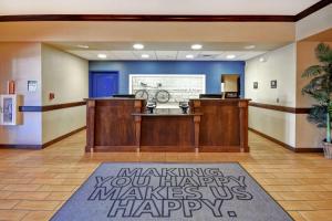 a lobby with a waiting area with a bike on the wall at Hampton Inn & Suites Folsom in Folsom