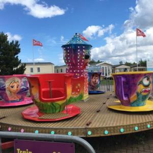a table with colorful cups on top of it at Blue Dolphin Holiday Park in Gristhorpe