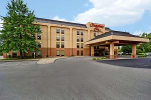 a hotel with a sign on the front of it at Hampton Inn Louisville Airport Fair/Expo Center in Louisville