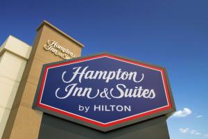 a sign for a hampton inn and suites at Hampton Inn & Suites Seattle-Downtown in Seattle